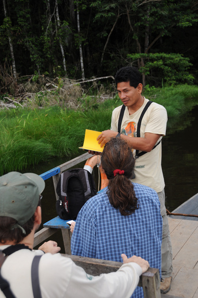 Local guide teaching class about conservation in the Amazon