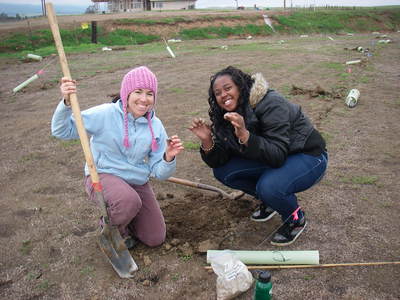 Graduate student mentor and high school student in environmental restoration